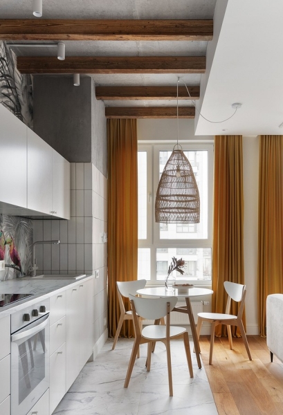 Белый цвет, тропические акценты и бетонный потолок: стильная однушка 38 кв. м в Москве