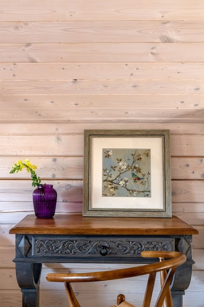 Как дизайнер оформила компактный домик 112 кв. м из бруса для семьи